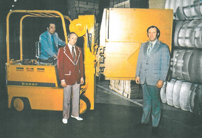 Bennett Material Handling founders with vintage forklift
